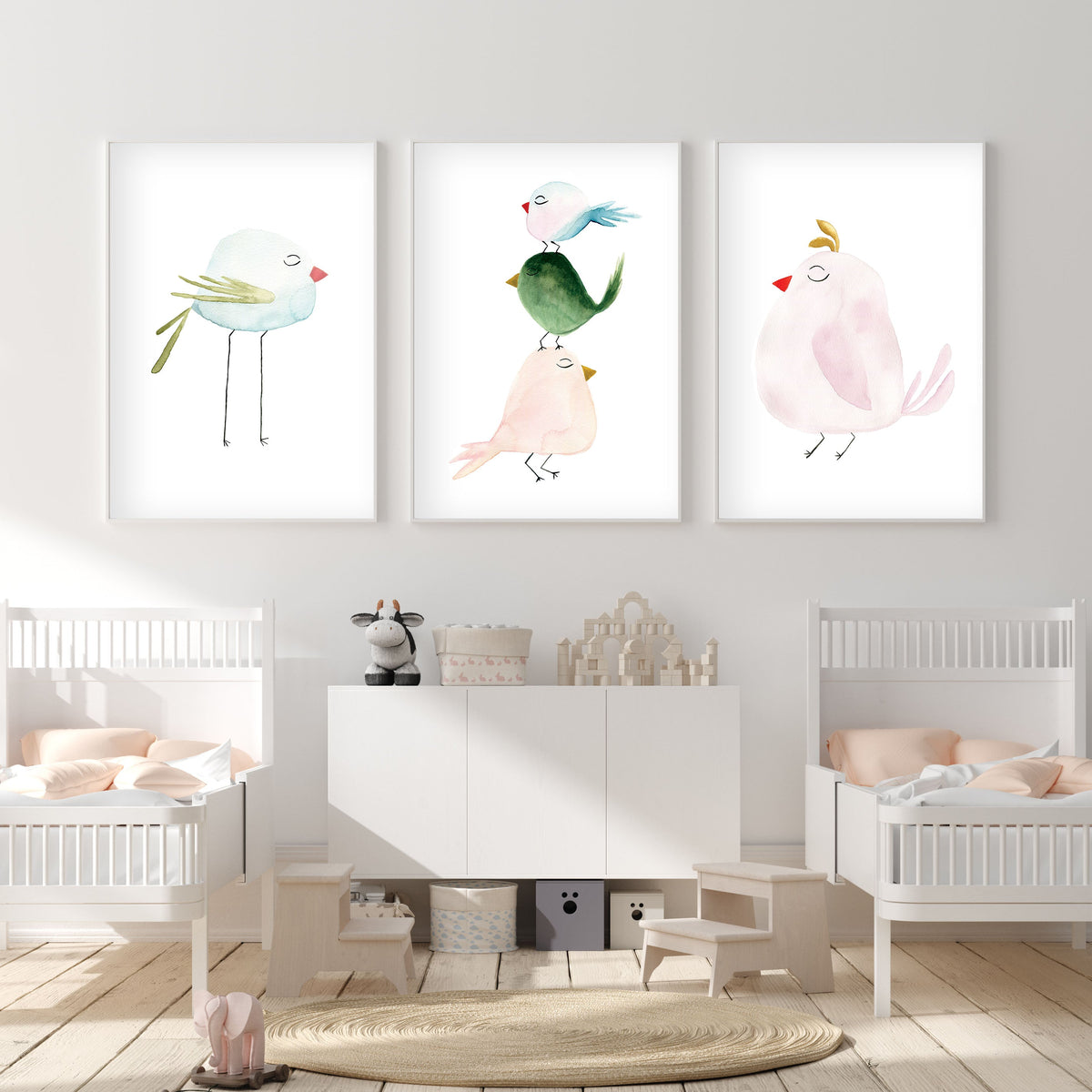 Three pastel bird watercolor art prints displayed in a coordinated set